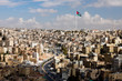 Photo: view of the city of Amman with Jordanian flags view of the city of Amman with Jordanian flags
