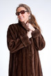 Girl wearing fur and sunglasses