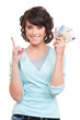 smiley woman holding money and pointing up smiley woman holding money and pointing up