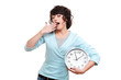 young woman holding clock and yawning young woman holding clock and yawning