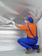Photo: Worker fitting vapour insulation foil Worker fitting vapour insulation foil