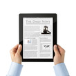 Reading busuness news at digital tablet