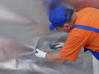 Worker fitting vapour insulation foil