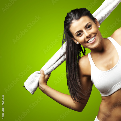 Photo: sporty woman holding towel sporty woman holding towel