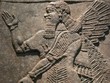 Ancient Assyrian wall carving of a man