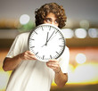 man hidden behind clock man hidden behind clock