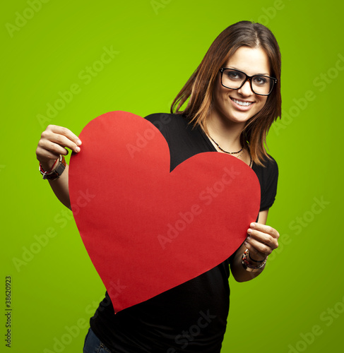 Photo: woman holding heart woman holding heart