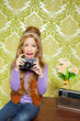 hip retro little girl shooting photo on vintage camera hip retro little girl shooting photo on vintage camera