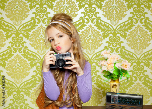 Photo: hip retro little girl shooting photo on vintage camera hip retro little girl shooting photo on vintage camera