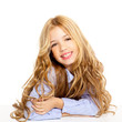 blond kid little girl portrait smiling on a desk in white