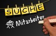 Tafel mit Hand - suche Mitarbeiter