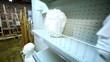 Several sculpture heads are on shelves in store