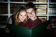young adult reading magic book in library