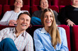 Couple and other people in cinema