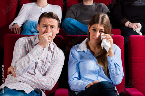 Photo: Couple and other people in cinema Couple and other people in cinema