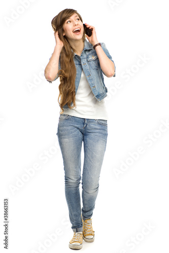 Photo: Young woman using mobile phone Young woman using mobile phone