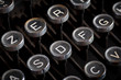 Photo: Old typewriter keyboard with silver and black round keys backgro Old typewriter keyboard with silver and black round keys backgro