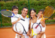 Family playing tennis