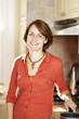 Foto: Happy woman in kitchen at home Happy woman in kitchen at home