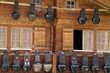 Photo: Swiss cow bells hanging outside traditional chalet Swiss cow bells hanging outside traditional chalet