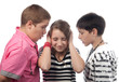 Two angry teenage boys harassing frightened girl