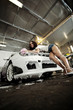 beautiful girl washes the car