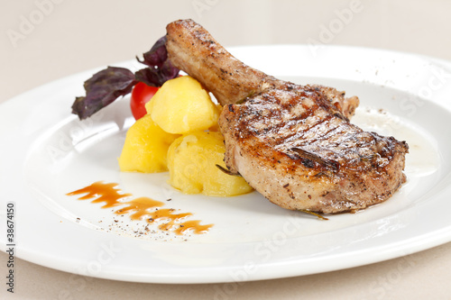 Photo: steak served with potatoes steak served with potatoes