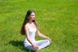 Photo: Girl sitting doing yoga outdoor Girl sitting doing yoga outdoor
