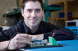 Detalii fotografie Engineer testing a circuit board assembly