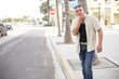 Man whistling for a cab