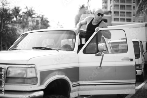 Photo: Man getting into his truck Man getting into his truck