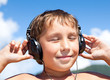 Boy listens to music on headphones