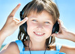 Happy little girl in headphones