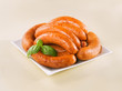 Fresh raw sausage on a plate