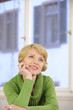 portrait of a woman wearing a green sweater