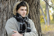 Young man portrait in park.