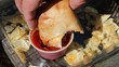 Dipping Calzone In Sauce Dipping Calzone In Sauce
