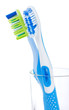 two tooth brushes in glass