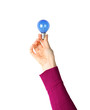 Hand supporting a light bulb