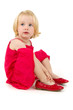 little girl in red shoes