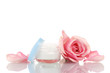 Face сream with pink roses isolated on white
