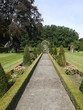 A path in perspective in a romantic garden