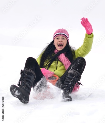 Photo: woman sledding woman sledding