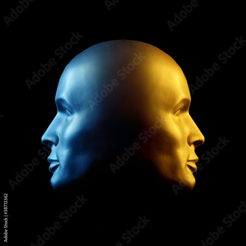 Photo: Two-faced head statue, blue and gold Two-faced head statue, blue and gold
