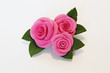 Artificial flowers (three big red roses with leaves)