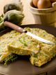 omelette with artichokes and knife