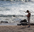 Woman beachcomb on Glass Beach