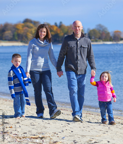 Photo: Family of four at the beach Family of four at the beach