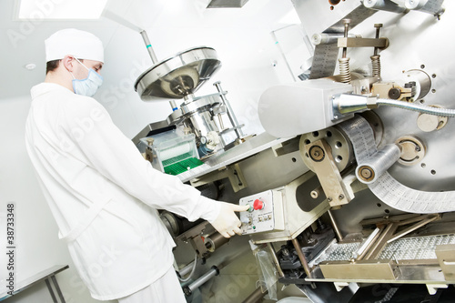 Photo: pharmaceutical factory worker pharmaceutical factory worker