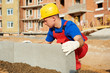 builder installing road concrete kerb